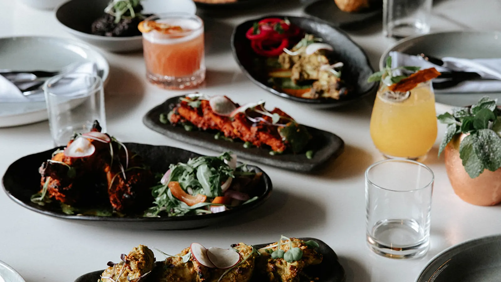 A table of dishes at Times of India Auckland